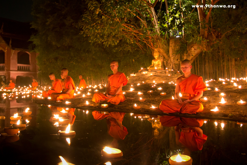Monk performing a Buddhist ceremony in a temple