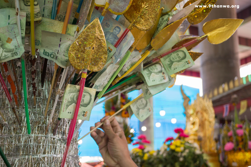 Offering food to monks in a Thai temple